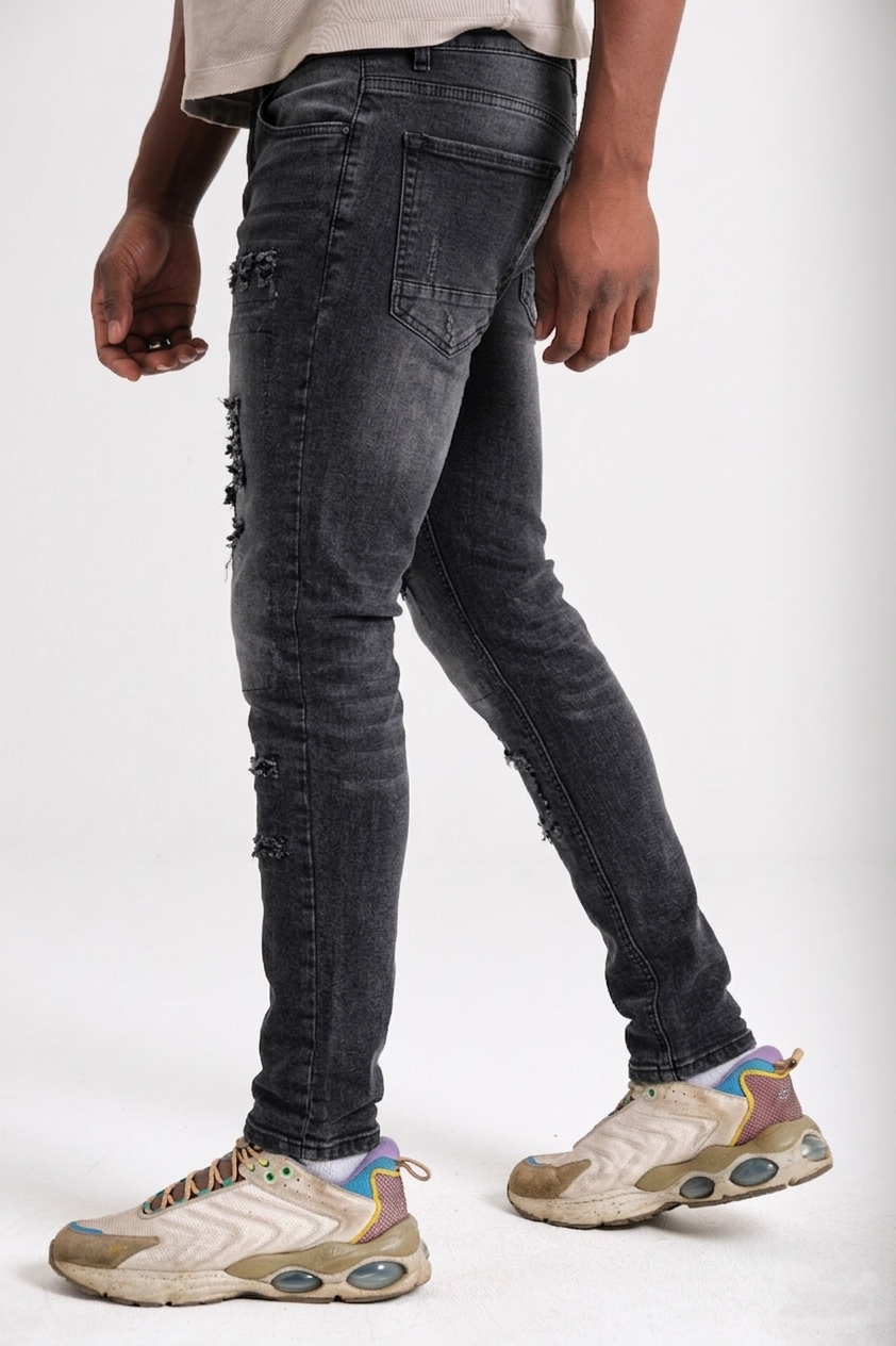 Men's distressed skinny jeans back view — Clutch Denim