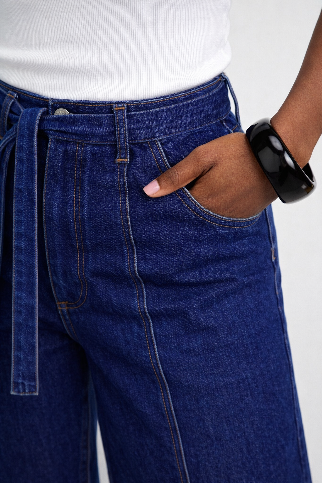 Wide-leg jeans with self-tie waist detail close-up — Clutch Denim
