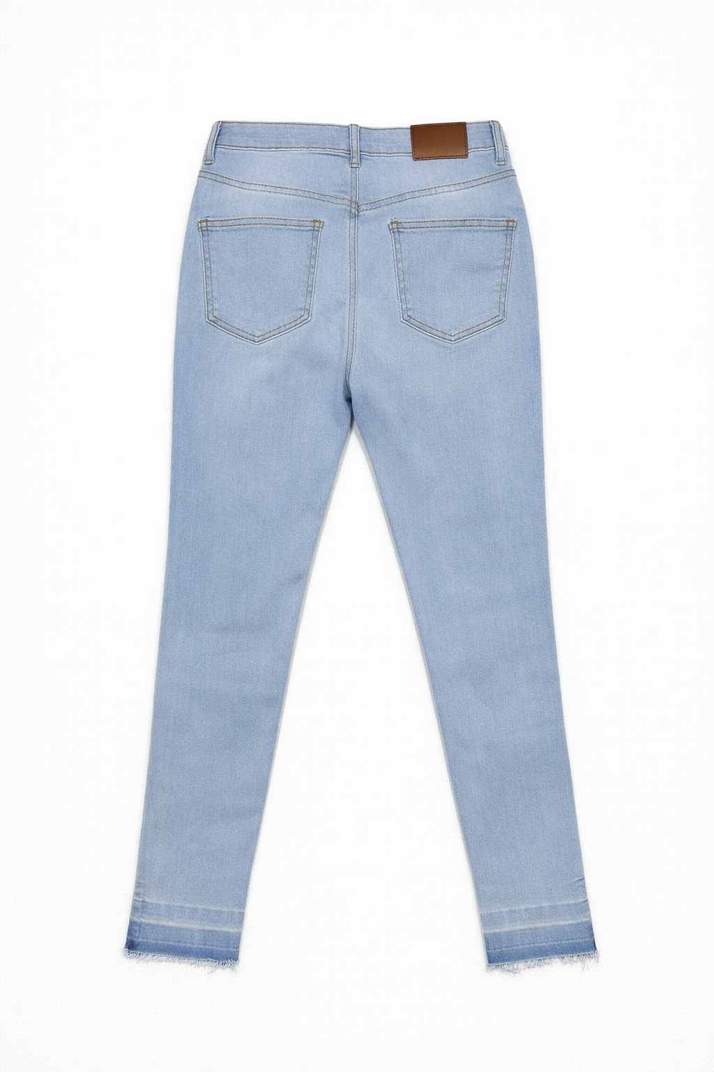 Light wash skinny jeans flat lay — Clutch Denim