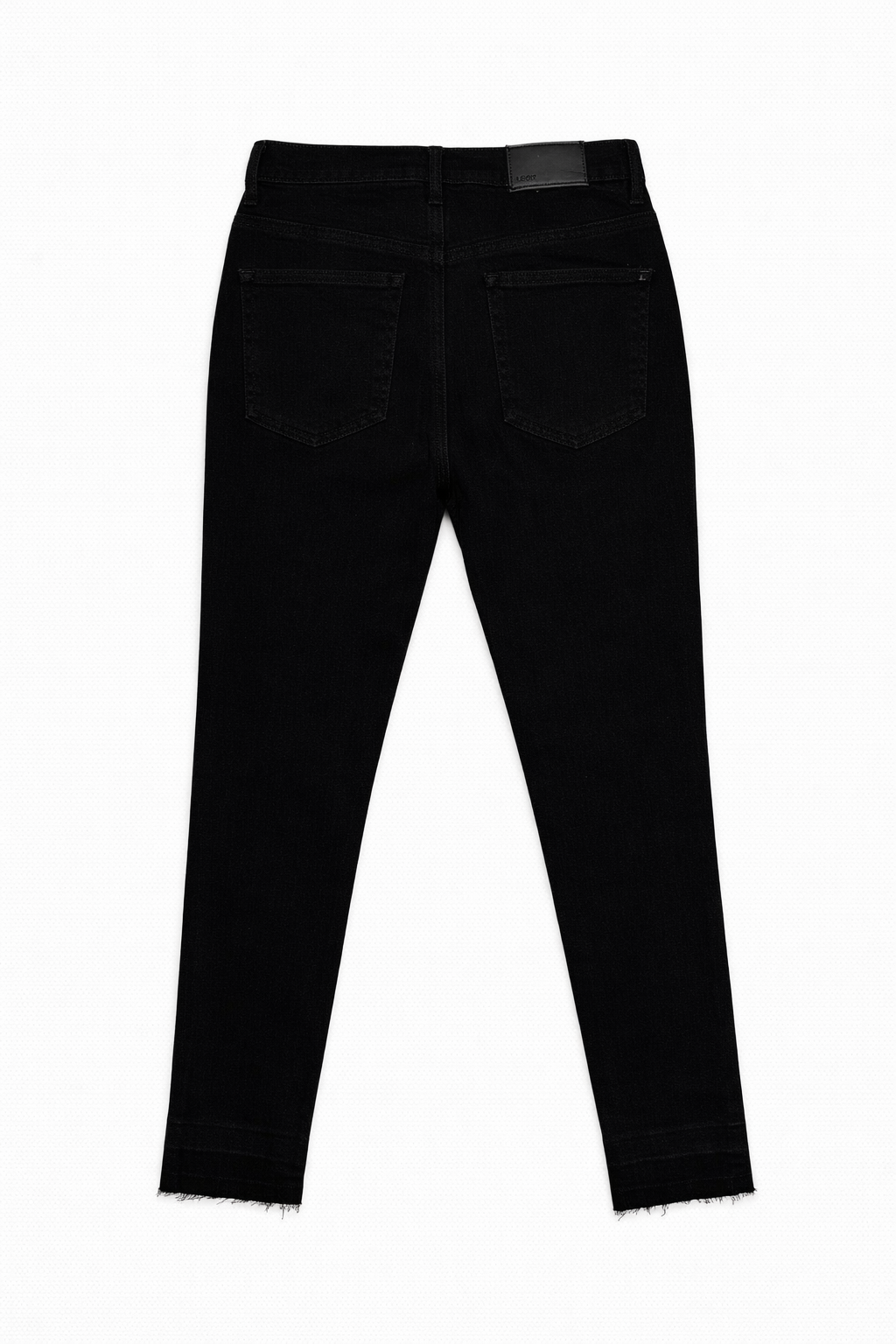Black skinny jeans raw hem detail — Clutch Denim