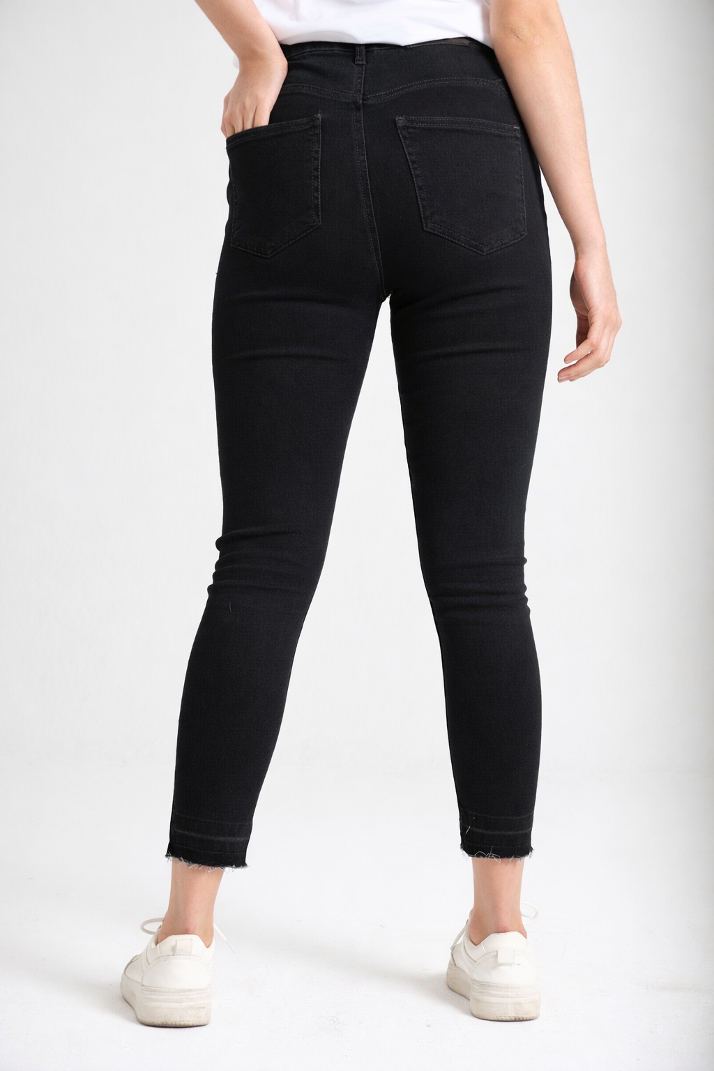 High-rise black skinny jeans back view — Clutch Denim