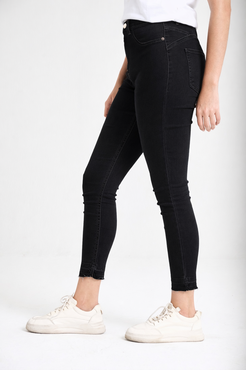 Women's black skinny jeans side view — Clutch Denim