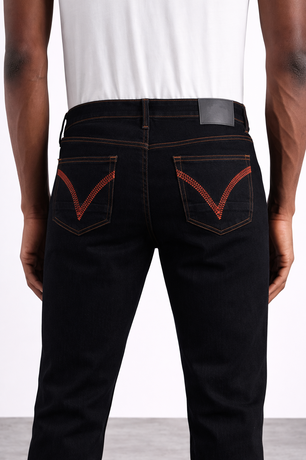 Black skinny jeans embroidered back pockets front view — Clutch Denim
