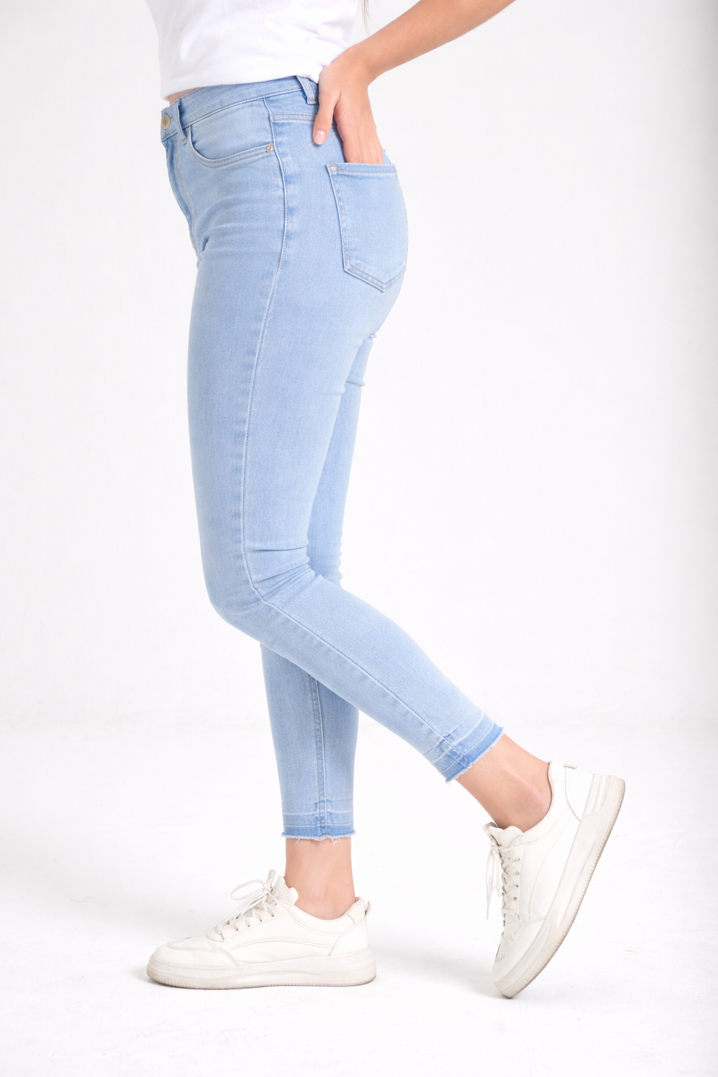 Women's light wash jeans side view — Clutch Denim