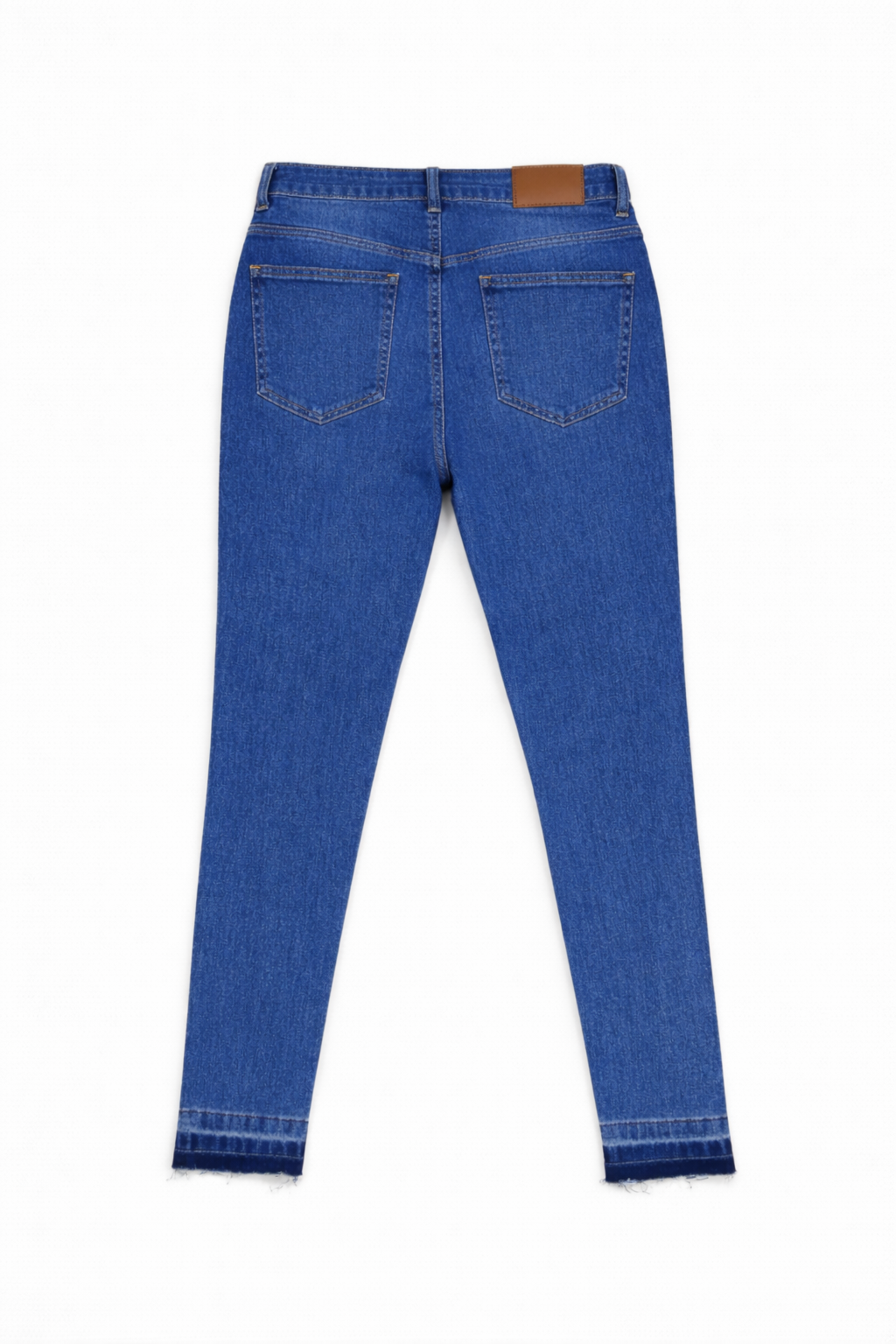 Medium wash skinny jeans flat lay — Clutch Denim