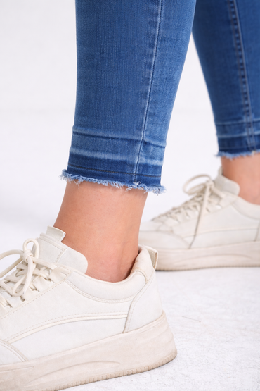 Medium wash raw-hem skinny jeans front view — Clutch Denim